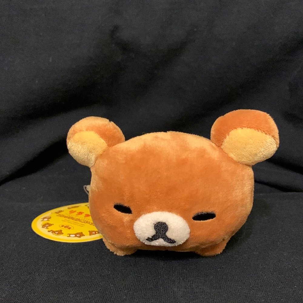Rilakkuma plush toy from Japan laying down NWT